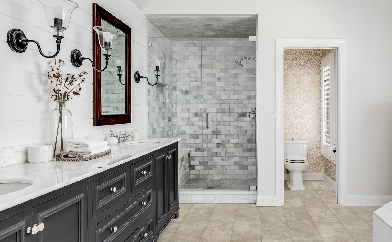 custom marble tile shower surround in bathroom